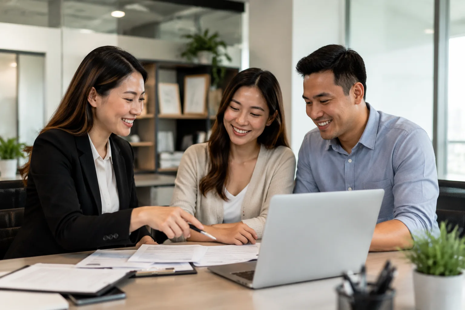 Megan Huynh consulting with a client on mortgage and real estate options at her Duluth, Georgia office
